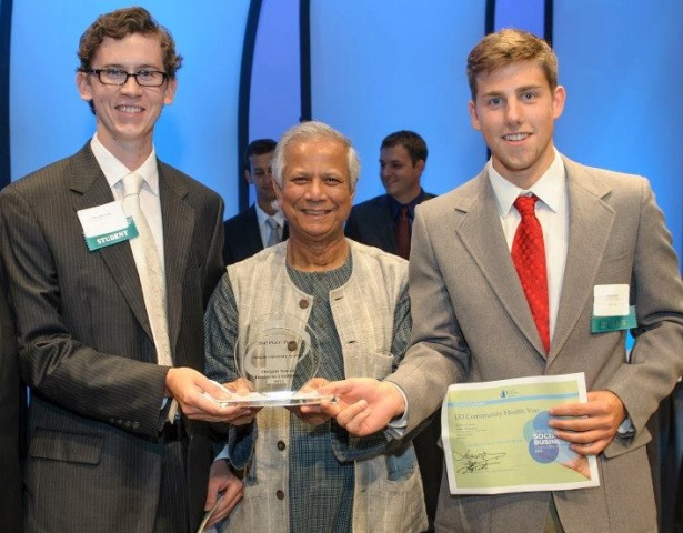 Orion (R) and Oliver (L) receive their award from Muhammad Yunus.